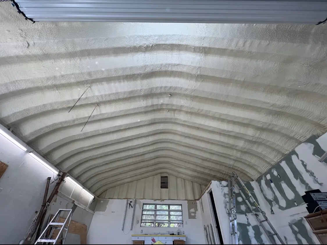 Spray polyurethane foam applied to the underside of a metal roof deck in Blairstown